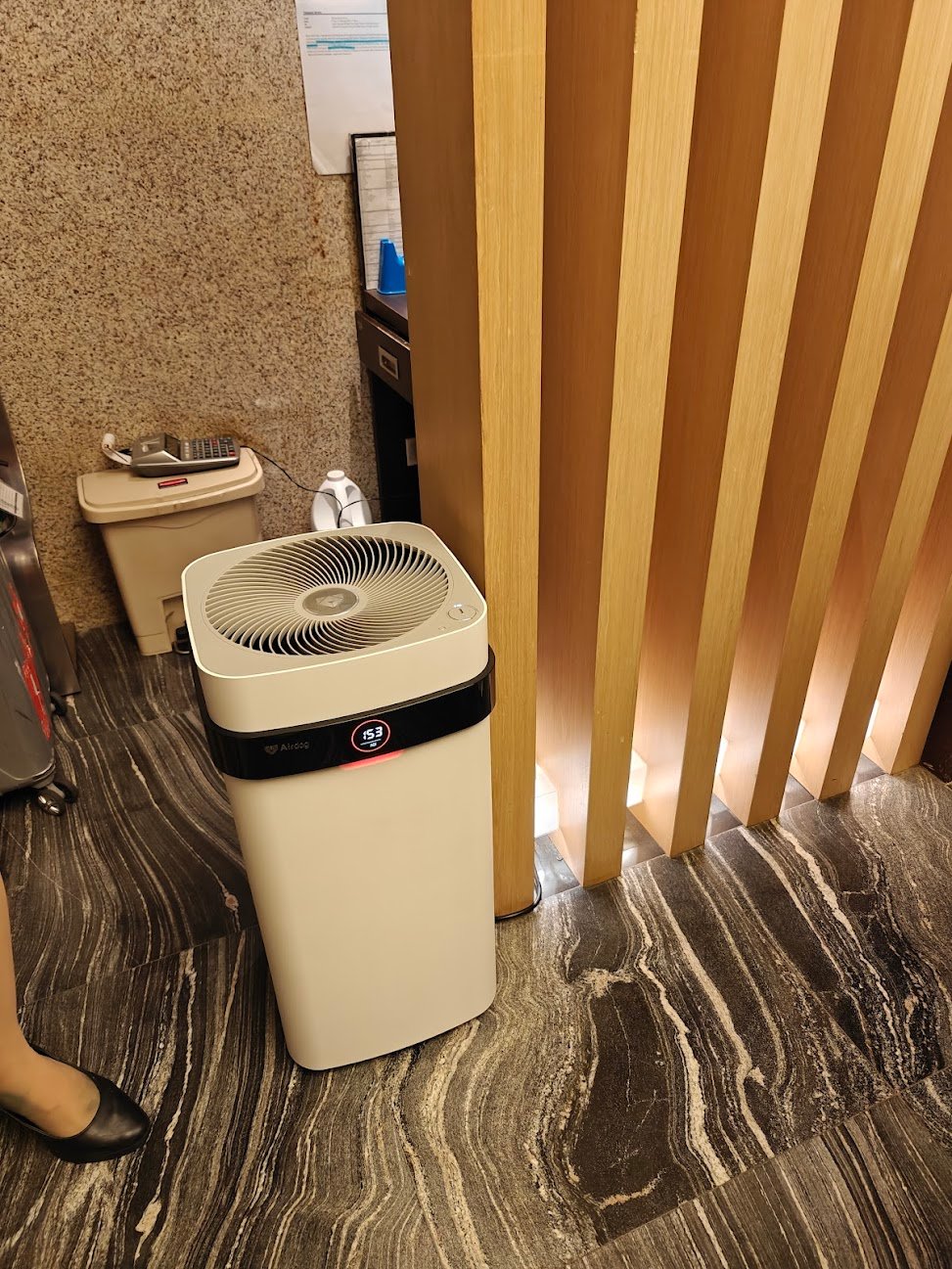 Airdog air purifier in a hotel lobby reception area